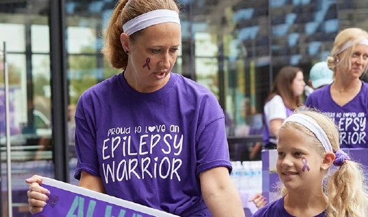A woman showing support to a child